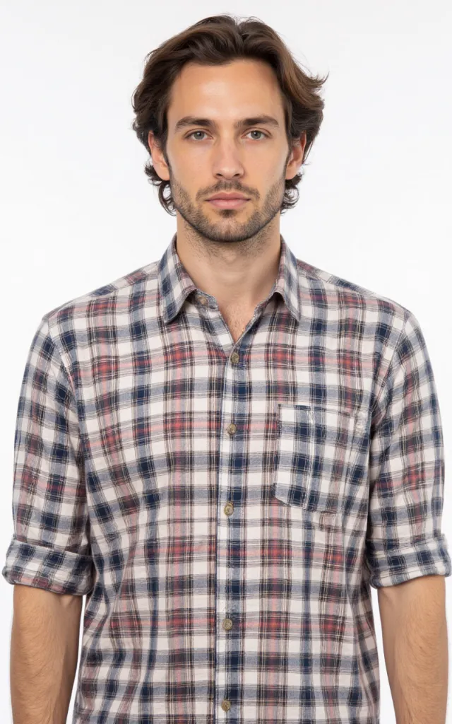 A French model wearing a Plaid pattern   printed shirt, against a white background, in a front   facing bust portrait